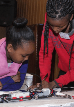 Two girls with a lego mindstorms robot